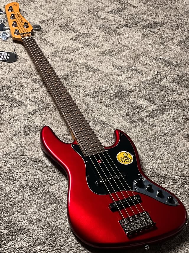 NEW GENERATION!!! Upgraded - loaded with new specs!!Squier kemanaaaa Squier???? Halooooo!!??Ready stock fresh just landed : Sire Marcus Miller V3-4 New Gen Electric Bass Guitar in Candy Apple RedCheck www.nafiriguitar.com for TONS of new Sire collection 2026!New Gen revision to Sire’s J-style V3 bass, loaded with tonal and performance-minded upgradesMahogany body offers a lightweight feel and classic J-style attitudeCanadian hard maple neck shaped into an optimized New Gen C-shape profile and sealed with an appealing tinted finish9.5-in.-radius rosewood fingerboard with ultra-smooth Edgeless rolled sidesNew Gen Marcus Standard J-Revolution pickups with alnico magnets dish out authentic J-style bite with a warm and expressive edgeSimplified New Gen preamp system with 2-band EQ makes dialing in your tone a breezePush-pull switching allows you to move between active and passive modesMarcus Standard bridge features both string-through-body and top-loader setups for enhanced versatilitySire Standard open-gear tuning machines keep your strings stable#sirebass #siremarcusmiller #sirenewgen by @nafirimusic