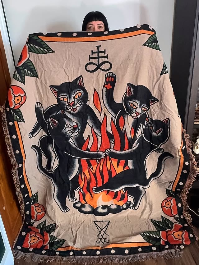 Happy post day today!!! Finally got my hands on the blanket & pillow cover i designed for @taketothegrave !! When @alexduquettetattoos asked me if i wanted to design one i didn’t think twice, i had been wanting to make my own for years but was too lazy so when he asked i said yes!! So happy with how it came out, the cats are gonna LOVE it!! 😭🥰🐈‍⬛🫶🏼🖤 question is, did you get yours? by @iris_lys