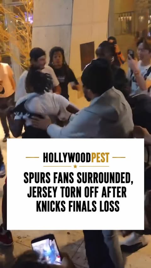 A Spurs fan found himself surrounded by a large group of Knicks fans while leaving Madison Square Garden after Game 3 of the NBA Finals. Although tensions were high and his jersey was eventually torn off, the scene appeared more like heated postgame roughhousing than an attempt to seriously harm him. Outnumbered but unfazed, the young fan stood his ground as the crowd reacted to the emotional Knicks loss.